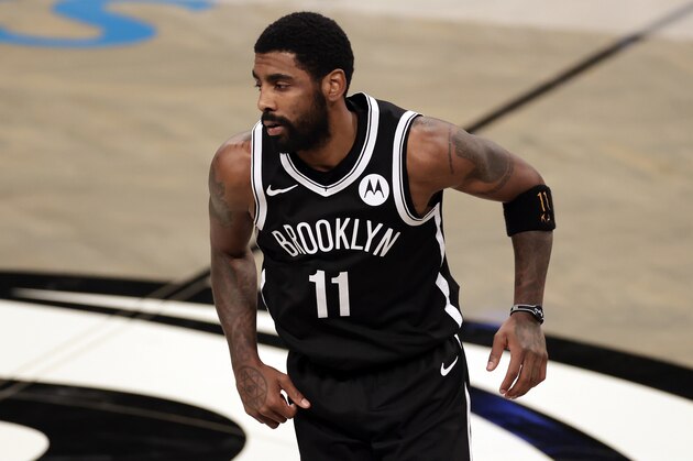 Brooklyn Nets guard Kyrie Irving (11) reacts during an NBA basketball game against the Atlanta Hawks, Friday, Jan. 1, 2021, in New York. The Hawks won 114-96. (AP Photo/Adam Hunger)
