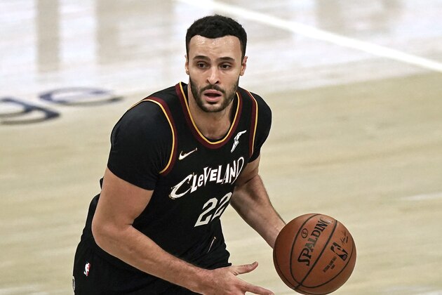 Cleveland Cavaliers' Larry Nance Jr. drives against the Philadelphia 76ers in the first half of an NBA basketball game, Sunday, Dec. 27, 2020, in Cleveland. (AP Photo/Tony Dejak)