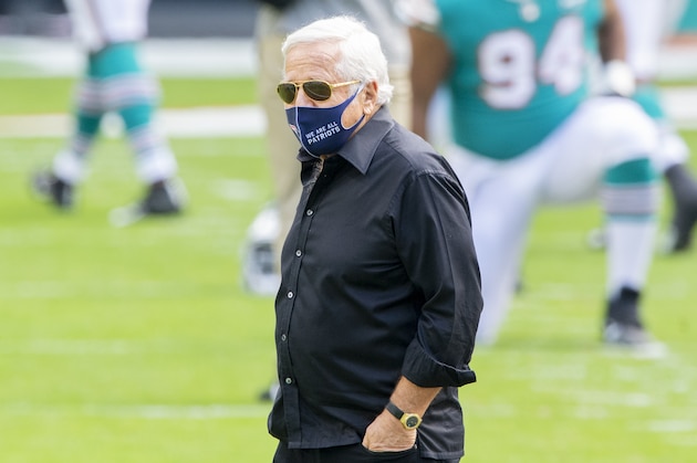 New England Patriots owner Robert Kraft wears a mask on the field before the Patriots take on the Miami Dolphins during an NFL football game, Sunday, Dec. 20, 2020, in Miami Gardens, Fla. (AP Photo/Doug Murray)