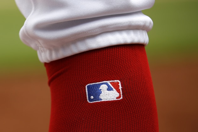 The Major League Baseball Logo is seen on Washington Nationals' Trea Turner's sock as he prepares for an at-bat during an interleague baseball game against the Chicago White Sox, Wednesday, June 5, 2019, in Washington. (AP Photo/Patrick Semansky)