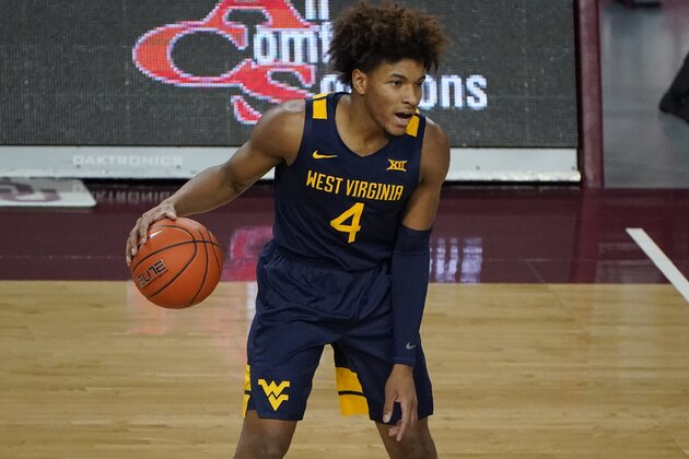 West Virginia guard Miles McBride (4) during an NCAA college basketball game against Oklahoma, Saturday, Jan. 2, 2021, in Norman, Okla. (AP Photo/Sue Ogrocki)