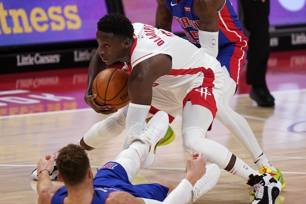 Houston Rockets guard Victor Oladipo (7) controls the ball after running into Detroit Pistons forward Blake Griffin during the second half of an NBA basketball game, Friday, Jan. 22, 2021, in Detroit. (AP Photo/Carlos Osorio)