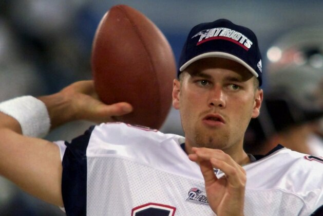 FILE - In this Aug. 4, 2000, file photo, New England Patriots backup quarterback Tom Brady warms up on the sidelines before an NFL football game against the Detroit Lions at the Silverdome in Pontiac, Mich. Brady grew from a sixth-round draft choice into one of the best quarterbacks in NFL history. On Tuesday, NFL commissioner Roger Goodell hears Brady's appeal of a four-game suspension for using deflated footballs in the AFC championship game. How will that affect Brady's legacy?  (AP Photo/Carlos Osorio, File)