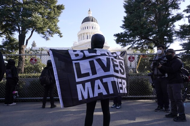 A demonstrator holds a