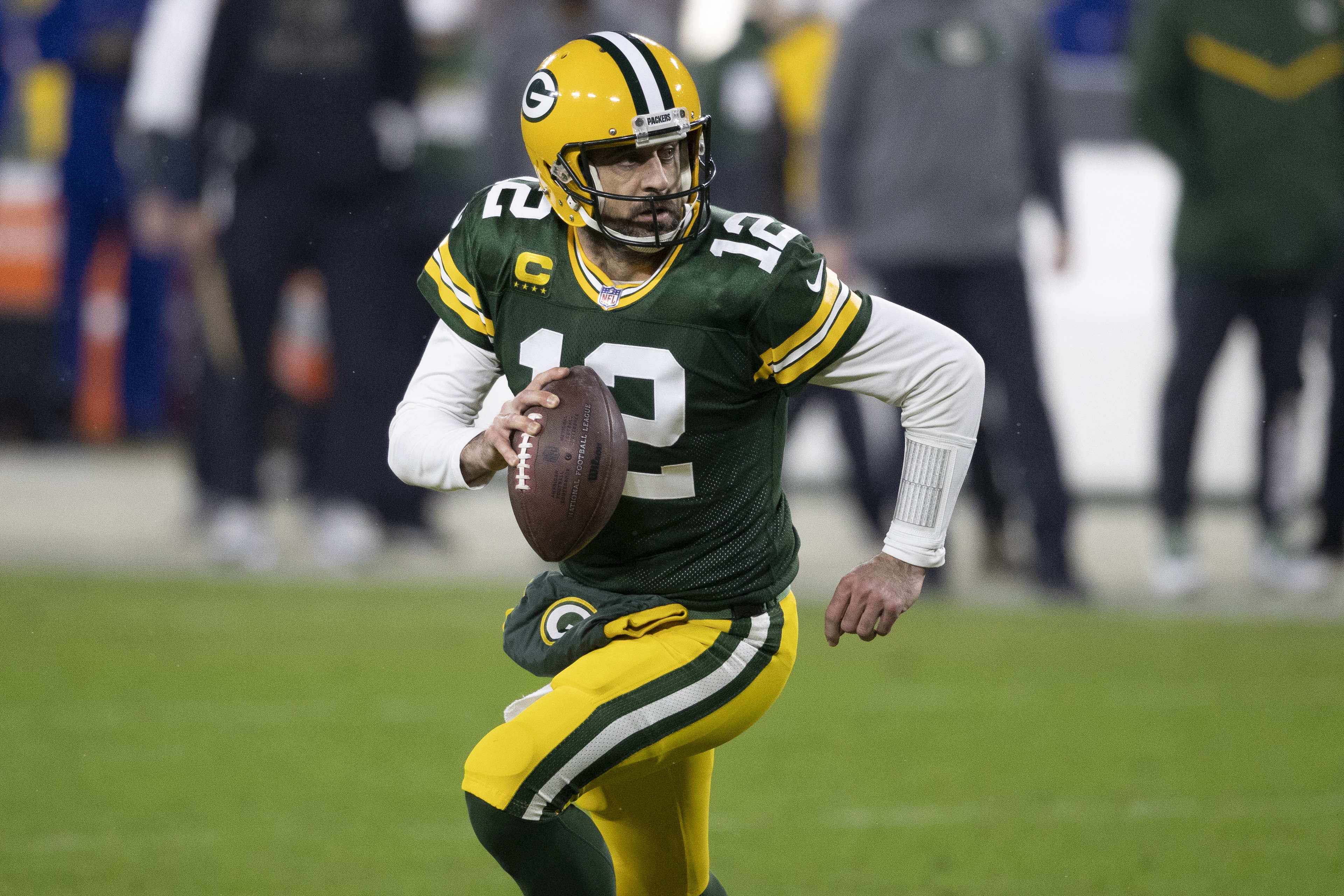 Green Bay Packers quarterback Aaron Rodgers (12) in action during an NFL divisional playoff football game between the Los Angeles Rams and Green Bay Packers, Saturday, Jan. 16, 2021, in Green Bay, Wis. (AP Photo/Jeffrey Phelps)