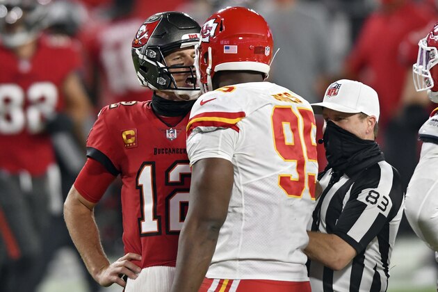 Tampa Bay Buccaneers quarterback Tom Brady (12) exchanges words with Kansas City Chiefs defensive tackle Chris Jones (95) as referee ShawnÂ  Hochuli (83) tries to separate the two during the second half of an NFL football game Sunday, Nov. 29, 2020, in Tampa, Fla. (AP Photo/Jason Behnken)