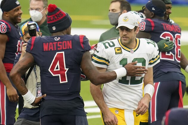 Houston Texans quarterback Deshaun Watson (4) and Aaron Rodgers (12) meet after an NFL football game against the Green Bay Packers, Sunday, Oct. 11, 2020, in Houston. (AP Photo/Matt Patterson)