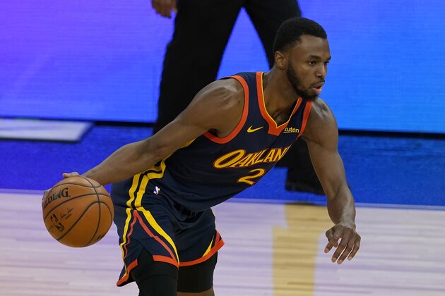 Golden State Warriors forward Andrew Wiggins dribbles against the Minnesota Timberwolves during the second half of an NBA basketball game in San Francisco, Monday, Jan. 25, 2021. (AP Photo/Jeff Chiu)