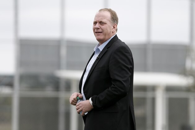 FILE- In this Feb. 25, 2015, file photo, baseball broadcast analyst and former Boston Red Sox pitcher Curt Schilling watches as the Red Sox workout at baseball spring training in Fort Myers Fla. Boston Mayor Martin J. Walsh wants to ban chewing tobacco in sports venues across the city. The mayor is expected to discuss a proposed new ordinance Wednesday, Aug. 5. Public health officials, advocates, local youth and Schilling are expected to attend. (AP Photo/Tony Gutierrez, File)