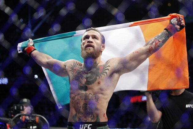 Conor McGregor celebrates after defeating Donald