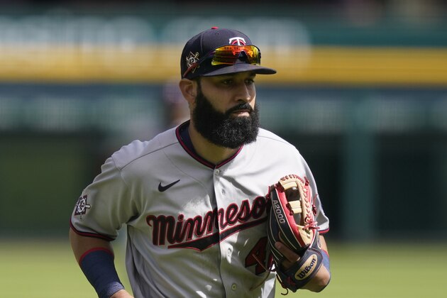 Minnesota Twins left fielder Marwin Gonzalez runs to the dugout during the seventh inning of a baseball game, Sunday, Aug. 30, 2020, in Detroit. (AP Photo/Carlos Osorio)