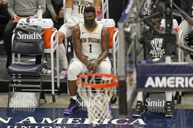 New Orleans Pelicans forward Zion Williamson (1) sits on the bench during the first half of the team's NBA basketball game against the Utah Jazz on Tuesday, Jan. 19, 2021, in Salt Lake City. (AP Photo/Rick Bowmer)