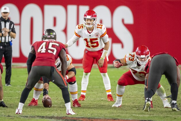 Kansas City Chiefs quarterback Patrick Mahomes (15) prepares to the take the snap of the ball from Kansas City Chiefs center Austin Reiter (62) along with Kansas City Chiefs guard Nick Allegretti (73) and Tampa Bay Buccaneers linebacker Devin White (45) during an NFL football game, Sunday, Nov. 29, 2020, in Tampa, Fla. (AP Photo/Doug Murray)