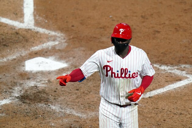 Philadelphia Phillies' Didi Gregorius reacts after hitting a two-run home run off New York Mets pitcher Rick Porcello during the fifth inning of a baseball game, Tuesday, Sept. 15, 2020, in Philadelphia. (AP Photo/Matt Slocum)