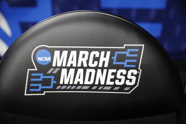 A chair with a logo is seen before a first round men's college basketball game between Minnesota and Louisville in the NCAA Tournament, Thursday, March 21, 2019, in Des Moines, Iowa. (AP Photo/Charlie Neibergall)