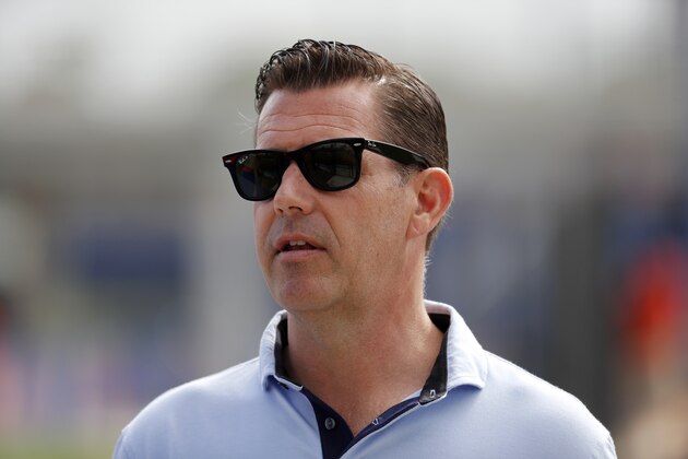 FILE - In this Feb. 15, 2020, file photo, New York Mets general manager Brodie Van Wagenen watches spring training baseball practice in Port St. Lucie, Fla. Van Wagenen and many of his top aides are out, moves announced less than an hour after hedge fund manager Steve Cohen completed his $2.4 billion purchase of the team Friday, Nov. 6, 2020.  (AP Photo/Jeff Roberson, File)