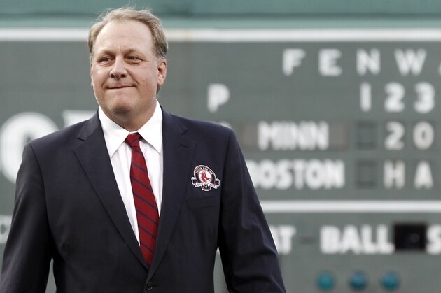Former Boston Red Sox pitcher Curt Schilling looks on after being introduced as a new member of the Boston Red Sox Hall of Fame before the baseball game between the Boston Red Sox and the Minnesota Twins at Fenway Park in Boston Friday, Aug. 3, 2012. (AP Photo/Winslow Townson)