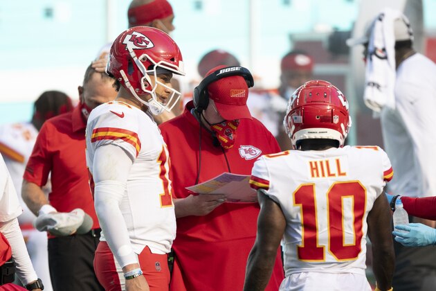Kansas City Chiefs quarterback Patrick Mahomes (15) talks with Kansas City Chiefs head coach Andy Reid and Kansas City Chiefs wide receiver Tyreek Hill (10) on the sidelines as the Chiefs take on the Miami Dolphins during an NFL football game, Sunday, DEC. 13, 2020, in Miami Gardens, Fla. (AP Photo/Doug Murray)
