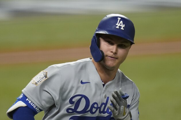 Los Angeles Dodgers' Joc Pederson celebrates a home run against the Tampa Bay Rays during the second inning in Game 5 of the baseball World Series Sunday, Oct. 25, 2020, in Arlington, Texas. (AP Photo/Eric Gay)