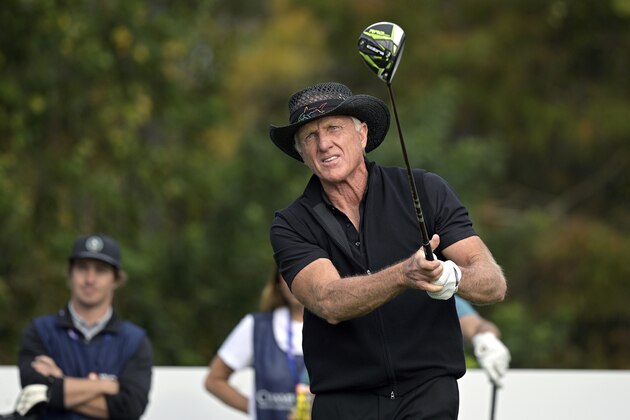 Greg Norman, of Australia, watches his tee shot on the first hole during the final round of the PNC Championship golf tournament, Sunday, Dec. 20, 2020, in Orlando, Fla. (AP Photo/Phelan M. Ebenhack)