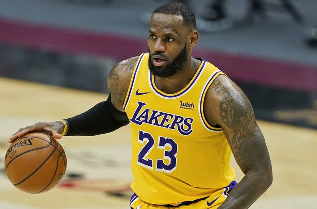 Los Angeles Lakers' LeBron James drives against the Cleveland Cavaliers in the second half of an NBA basketball game, Monday, Jan. 25, 2021, in Cleveland. (AP Photo/Tony Dejak)