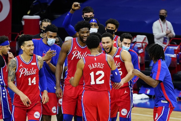 Philadelphia 76ers' Tobias Harris (12) celebrates with teammates after an NBA basketball game against the Los Angeles Lakers, Wednesday, Jan. 27, 2021, in Philadelphia. (AP Photo/Matt Slocum)