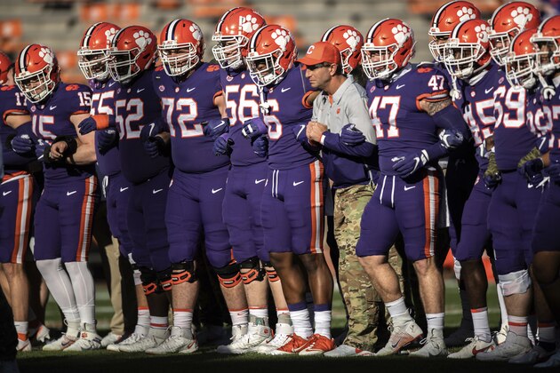 Clemson head coach Dabo Swinney does the walk of champions together with his players before an NCAA college football game against Pittsburgh Saturday, Nov. 28, 2020, in Clemson, S.C. (Ken Ruinard/Pool Photo via AP)