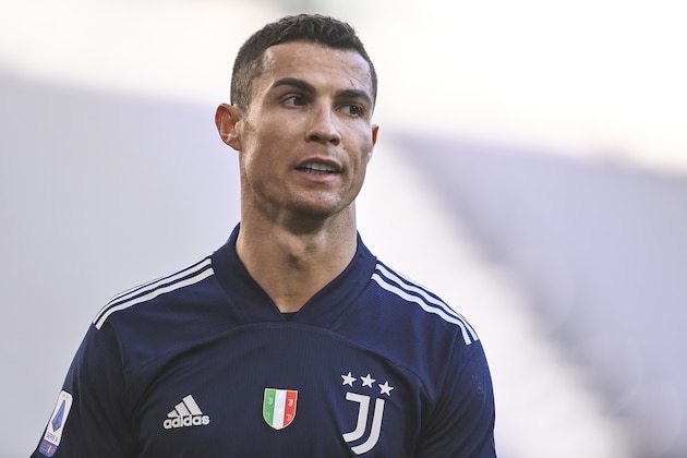 Juventus' Cristiano Ronaldo walks on the pitch during the Serie A soccer match between Juventus and Bologna, at the Allianz Stadium in Turin, Italy, Sunday, Jan. 24, 2021. (Fabio Ferrari/LaPresse via AP)