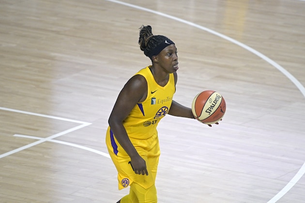 Los Angeles Sparks guard Chelsea Gray (12) sets up a play during the second half of a WNBA basketball game against the Washington Mystics, Thursday, Sept. 10, 2020, in Bradenton, Fla. (AP Photo/Phelan M. Ebenhack)