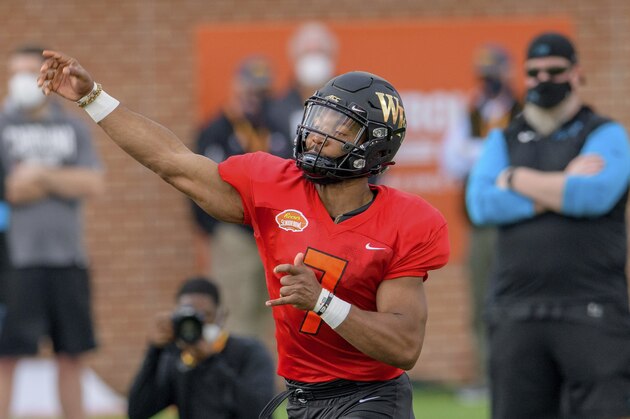 American Team quarterback Jamie Newman of Wake Forest (7) throws during the American Team practice for the NCAA Senior Bowl college football game in Mobile, Ala. Wednesday, Jan. 27, 2021. (AP Photo/Matthew Hinton)
