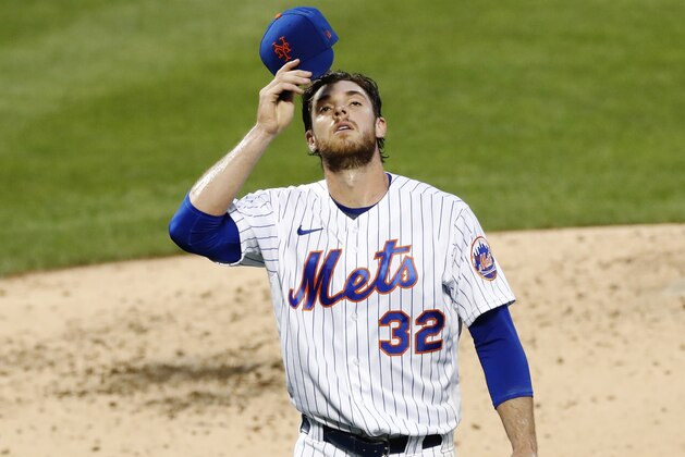 New York Mets starting pitcher Steven Matz (32) walks off the mound after a rough outing against the Washington Nationals in a baseball game, Monday, Aug. 10, 2020, in New York. (AP Photo/Kathy Willens)
