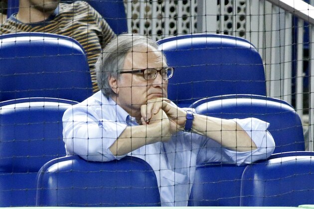 FILE - Miami Marlins owner Jeffrey Loria watches during the eighth inning of a baseball game between the Marlins and the New York Mets in Miami, in this Tuesday, June 27, 2017, file photo. Former Miami Marlins owner Jeffrey Loria reached a lawsuit settlement to reimburse local government $4.2 million for the cost of building Marlins Park, which opened in 2012. (AP Photo/Wilfredo Lee, File)