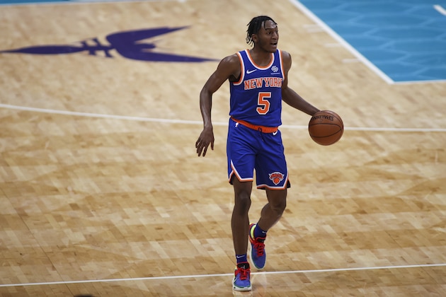 New York Knicks guard Immanuel Quickley brings the ball upcourt against the Charlotte Hornets in the first half of an NBA basketball game in Charlotte, N.C., Monday, Jan. 11, 2021. (AP Photo/Nell Redmond)