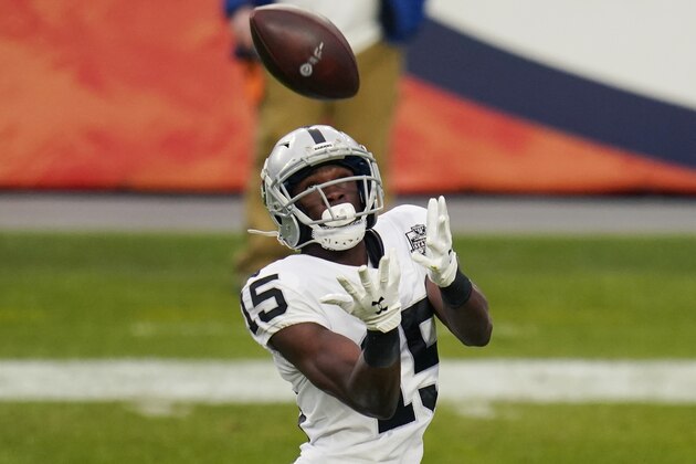 Las Vegas Raiders wide receiver Nelson Agholor (15) catches a pass against the Denver Broncos during the first half of an NFL football game, Sunday, Jan. 3, 2021, in Denver. (AP Photo/Jack Dempsey)