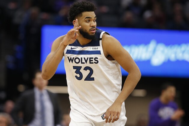 Minnesota Timberwolves center Karl-Anthony Towns flashes three fingers after scoring a 3-pointer during the second half of an NBA basketball game against the Sacramento Kings in Sacramento, Calif., Monday, Feb. 3, 2020. The Kings won 113-109. (AP Photo/Rich Pedroncelli)