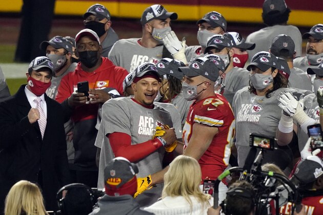 Kansas City Chiefs quarterback Patrick Mahomes celebrates with Kansas City Chiefs tight end Travis Kelce (87) and teammates after the AFC championship NFL football game against the Buffalo Bills, Sunday, Jan. 24, 2021, in Kansas City, Mo. The Chiefs won 38-24. (AP Photo/Jeff Roberson)