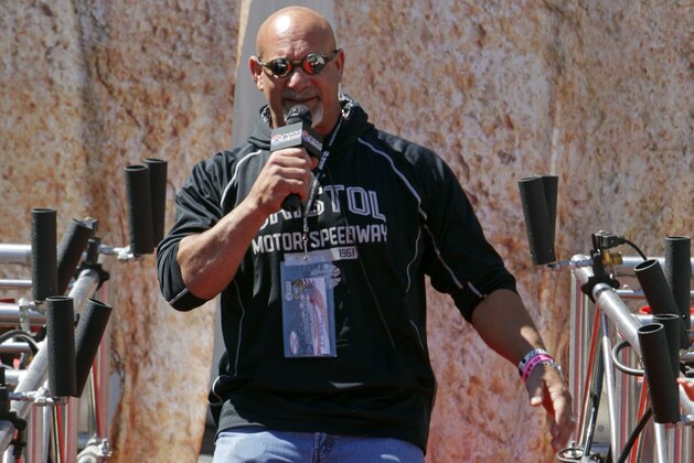 Retired professional wrestler and actor, Bill Goldberg walks down the red carpet to make driver introductions before a NASCAR Sprint Cup Series auto race, Sunday, April 17, 2016 in Bristol, Tenn. (AP Photo/Wade Payne)