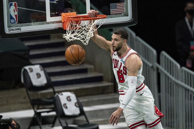 Chicago Bulls guard Zach LaVine (8) dunks the ball against the Charlotte Hornets during the first half of an NBA basketball game in Charlotte, N.C., Friday, Jan. 22, 2021. (AP Photo/Jacob Kupferman)