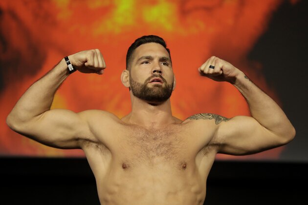 Chris Weidman poses for photographers during the weigh-ins ahead of his mixed martial arts middleweight bout against Ronaldo Souza at UFC 230, Friday, Nov. 2, 2018, at Madison Square Garden in New York. (AP Photo/Julio Cortez)
