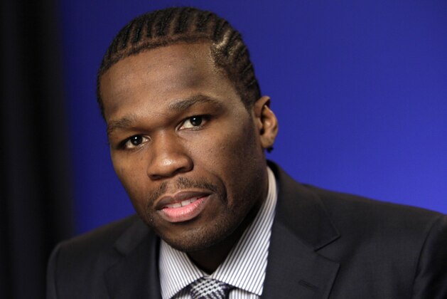 FILE - In this Oct. 26, 2011 file photo, Rapper and businessman Curtis Jackson III, known as 50 Cent, poses during an interview in New York. Police in St. Kitts and Nevis say that U.S. rapper 50 Cent and a member of his entourage were detained and charged for allegedly using “indecent language” during his performance at the St. Kitts Music Festival, Saturday, June 25, 2016.  (AP Photo/Richard Drew, File)