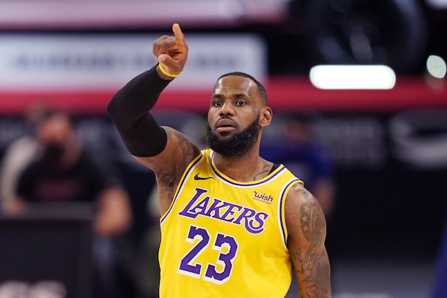 Los Angeles Lakers forward LeBron James plays during the first half of an NBA basketball game, Thursday, Jan. 28, 2021, in Detroit. (AP Photo/Carlos Osorio)