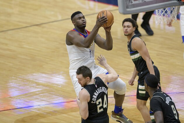 New Orleans Pelicans forward Zion Williamson (1) shoots over Milwaukee Bucks guard Pat Connaughton (24) in the first half of an NBA basketball game in New Orleans, Friday, Jan. 29, 2021. (AP Photo/Matthew Hinton)