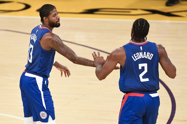 Los Angeles Clippers guard Paul George, left, celebrates his basket with forward Kawhi Leonard during the first half of the team's NBA preseason basketball game against the Los Angeles Lakers in Los Angeles, Friday, Dec. 11, 2020. (AP Photo/Kyusung Gong) Los Angeles Clippers guard Paul George, left, celebrates his basket with forward Kawhi Leonard during the first half of the team's NBA preseason basketball game against the Los Angeles Lakers in Los Angeles, Friday, Dec. 11, 2020. (AP Photo/Kyusung Gong)
