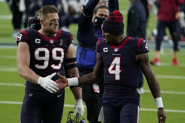 Houston Texans defensive end J.J. Watt (99) and quarterback Deshaun Watson (4) walk off the field after an NFL football game against the Tennessee Titans Sunday, Jan. 3, 2021, in Houston. The Titans won 41-38. (AP Photo/Eric Christian Smith)
