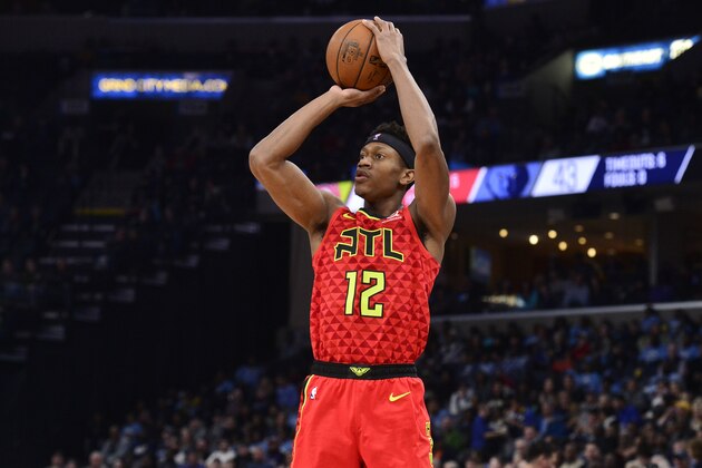 Atlanta Hawks forward De'Andre Hunter (12) shoots the ball in the first half of an NBA basketball game against the Memphis Grizzlies Saturday, March 7, 2020, in Memphis, Tenn. (AP Photo/Brandon Dill)