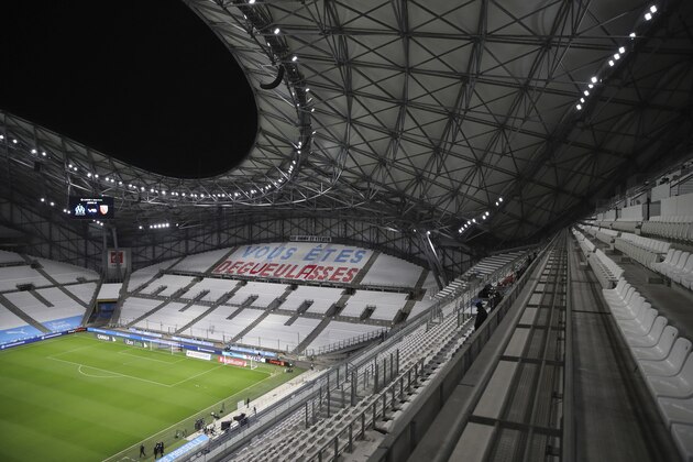 A tribune is decorated by Marseille fans directed at their team reads