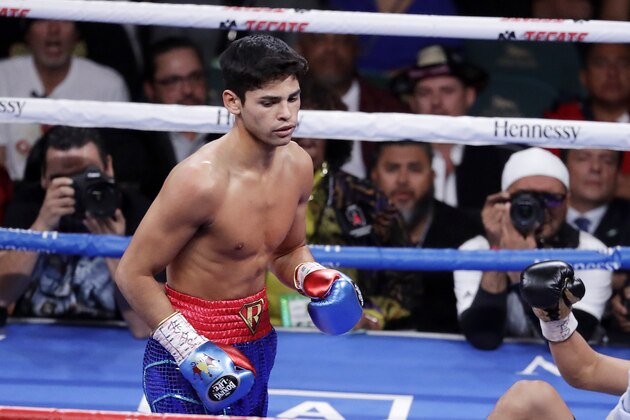 FILE - In this Nov. 2, 2019 file photo, Ryan Garcia, looks on after landing a punch to Romero Duno (not seen) during their lightweight boxing match in Las Vegas.   Garcia meets Britainâ€™s Luke Campbell, a 2012 Olympic champion, in an interim WBC lightweight title fight. The bout was postponed a month and moved from California after Campbell tested positive for COVID-19.(AP Photo/Isaac Brekken, File)
