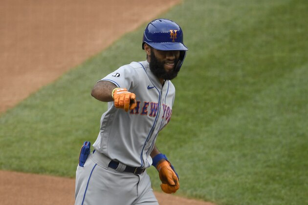 New York Mets' Amed Rosario celebrates his home run during the fourth inning of the first baseball game of a doubleheader against the Washington Nationals, Saturday, Sept. 26, 2020, in Washington. The game is a makeup from Sept. 25. (AP Photo/Nick Wass)