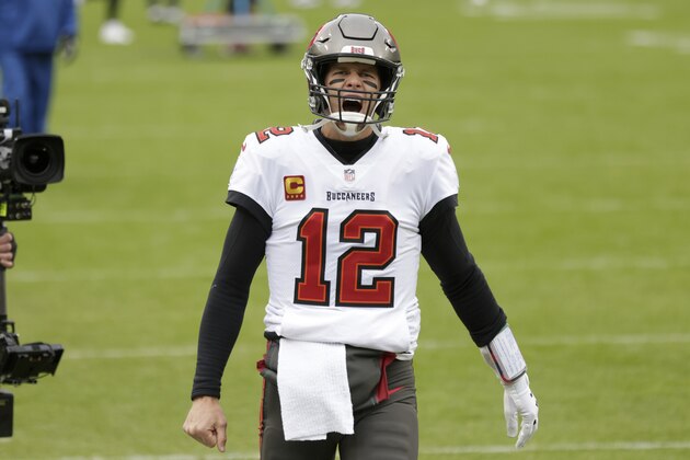 Tampa Bay Buccaneers quarterback Tom Brady yells as he takes to the field before the NFC championship NFL football game against the Green Bay Packers in Green Bay, Wis., Sunday, Jan. 24, 2021. (AP Photo/Matt Ludtke)