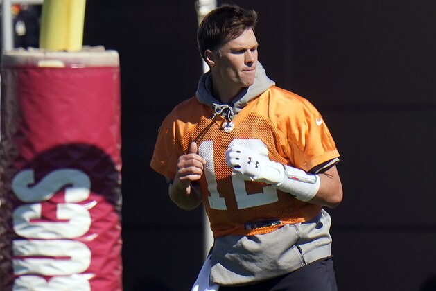 Tampa Bay Buccaneers quarterback Tom Brady (12) runs with a elastic band around his legs during an NFL football workout Thursday, Jan. 28, 2021, in Tampa, Fla. The Buccaneers play the Kansas City Chiefs in Super Bowl LV on Feb. 7. (AP Photo/Chris O'Meara)